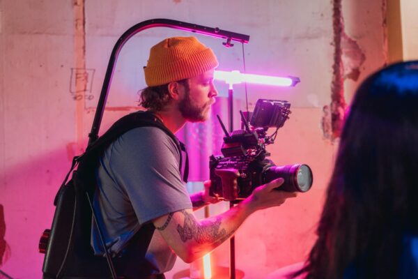 A man holding a camera in his hand.