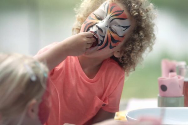 A child with face paint on his face.